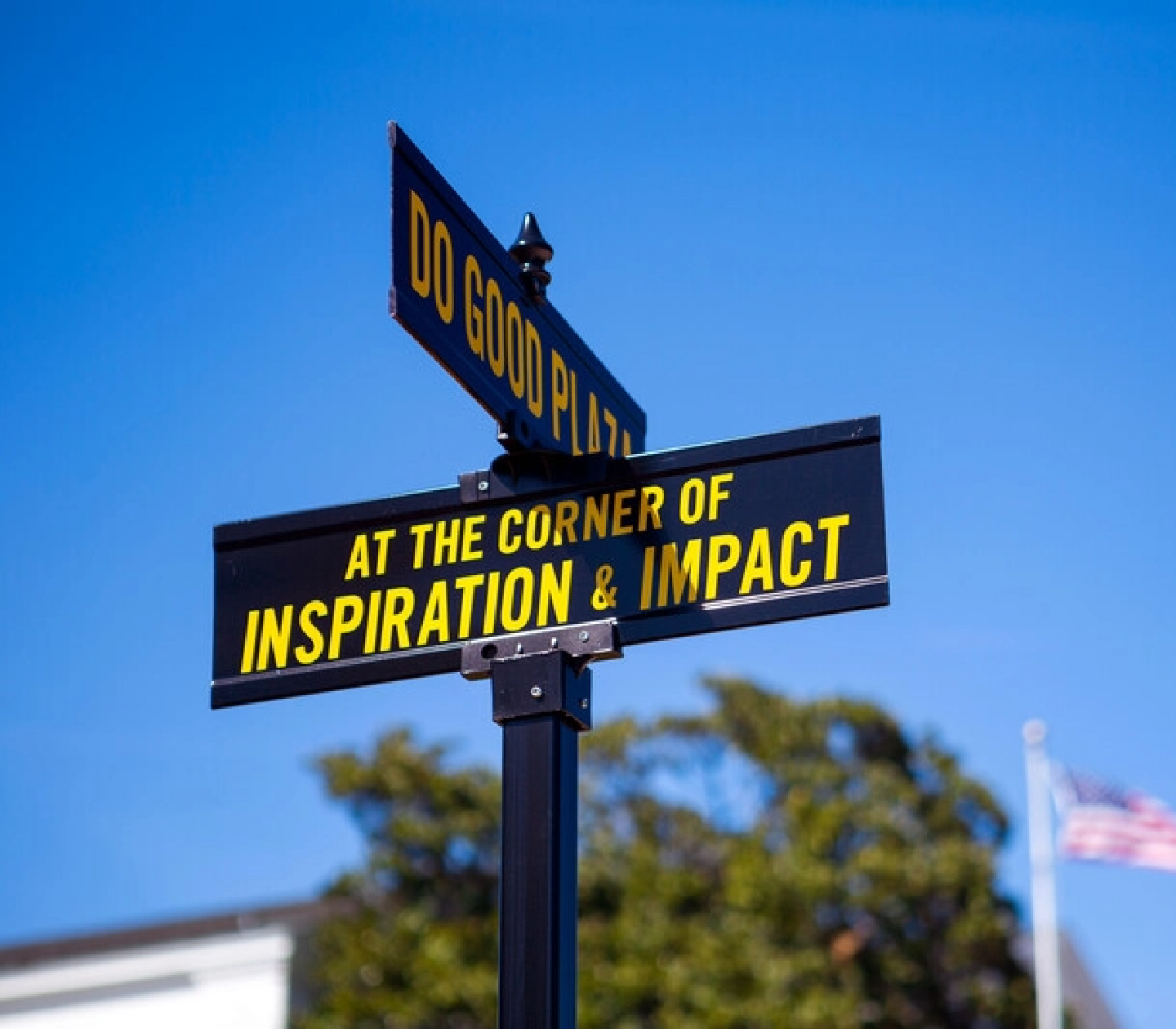 Street signs that say At the Corner of Inspiration & Impact